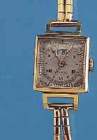 MOVADO DAMENARMBANDUHR DAY DATE, REF.-NR. 3025, SCHWEIZ UM 1940, GG 750/000, GG-KORDEL- BAND, NEUTR. SPAETER, BODEN GEDR., BLATT VERS., FL., ...