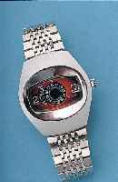 TD HERRENARMBANDUHR DIGITAL, SCHWEIZ UM 1970METALL MASSIV-GEH. HARTVERCHR., EDELST.-SCHR.-BODEN, NEUTR. EDELST.-BAND, AUTOMATIK, DATUM U. STD. ...