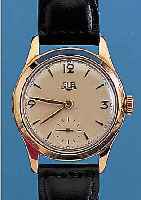 GUB HERRENARMBANDUHR, REF.-NR. 050470, DEUTSCHLAND UM 1955, METALL ROSEVERG., EDEL- ST.-SCHR.-BODEN, GUILL. U. CREMEFARB. LACKIER-TES BLATT, ...