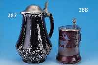 DECKELKRUG, REINHOLD MERKELBACH GRENZHAUSEN, DATIERT 1928, STEINZEUG, REICH RELIEFIERT UND BLAU GLASIERT, ZINNDECKEL, H. CA. 24 CM
