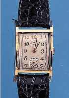 LORD ELGIN HERRENARMBANDUHR, REF.-NR. 4617, USA UM 1950, GG-FILLED, RECT.-FORM, BODEN GEDR., IN SICH GEW., FORMANKERW., 21 ST., ...
