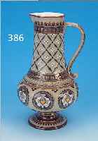 HENKELKRUG, METTLACH, UM 1889, STEINGUT, RELIEF. FLORALER DEKOR, BUNT STAFFIERT, GOLD- STAFFAGE, H. 36 CM