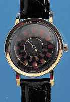 NIVADA HERRENARMBANDUHR COCKTAILS WATCH, SCHWEIZ/USA UM 1956, METALL M. GG-AUFLAGE, EDELST.-BODEN GEDR., MYSTERIEUSE ANZEIGE DURCHROTIERENDE ...