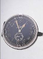 JUNGHANS EINBAUBORDUHR, DEUTSCHLAND UM 1939,BAKELITGEH., AUFZUG U. ZEIGERST. RüCKS., AUF- KLAPPB., KAL. J30D, EINBAUD. CA. 55 MM, NUTZ- SP., ...