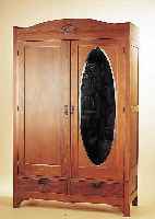 KLEIDERSCHRANK, DEUTSCH, UM 1920, EICHE MEIST MASSIV, OVALER SPIEGEL, ZWEI SOCKELSCHüBE, GESCHNITZT, 204 X 130 X 54 CM, DREI ...