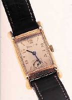 BULOVA HERRENARMBANDUHR, USA UM 1952, GG-FILLED, AUFW. RECT.-FORM, BODEN GEDR., VERS. BLATT, KL. SEK. VERT., FORMANKERW., 21 ST., ...