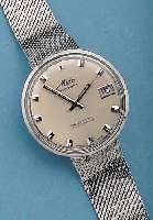 MIDO HERRENARMBANDUHR ELEKTRONIK-CHRONOMETER, REF.-NR. 7077, SCHWEIZ UM 1967, EDELST., EINSCHALENAUSF., EDELST.-FLECHTBAND, VERS. BLATT ...
