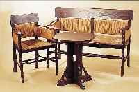 SITZGRUPPE, FRIESLAND, UM 1900, BUCHE DUNKEL GEBEIZT, MIT BINSENGEFLECHT, BEST. AUS KL. BANK, ZWEI SESSEL UND TISCH, L. ...
