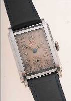 HERRENARMBANDUHR DATUM, SCHWEIZ UM 1934, NICKEL/CHROM, SCHRANIERBODEN BER., VERS. ORIG.-BLATT, FARBL. GET., DATUM BEI 12, RUNDANKER- W., 15 ST., ...