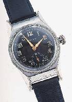 RELLUM FLIEGERARMBANDUHR, SCHWEIZ UM 1936, MASSIV METALL VERCHR., BODEN GESCHR., LüNETTE M. ZEIGER DREHB., ORIG.-BLATT, LEUCHTFARBE BRüCHIG, ...