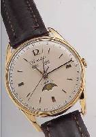 HERRENARMBANDUHR VOLLKALENDER, SCHWEIZ UM 1956, METALL NACHVERG., EDELST.-BODEN U. GLAS-R. GEDR., BLATT REST., BEZ. CORTEBERT (WOHL FEHLDRUCK), ...