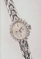 ZENITH DAMENSCHMUCKBANDUHR, SCHWEIZ UM 1972WG 750/000 INCL. BAND RHOD., OVALLüNETTE M. 20 8/8 DIAMANTEN ZUS. CA. 0,4 CT L. GET. ...