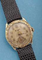 CORTEBERT HERRENARMBANDUHR, SCHWEIZ/DEUTSCH-LAND UM 1934, GG 585/000, BODEN U. GLASR. GE- DR., LüNETTE RELIEFIERT, LORBEERDEKOR, VERS. BLATT ...