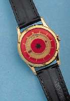 CREATION HERRENARMBANDUHR MYSTERIEUSE, SCHWEIZ UM 1957, METALL HARTVERG., BEIDS. VER-GL., ANZEIGE TEILVERD., 15 ST., RUNDANKERW., ...