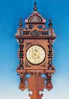 WANDUHR, JUNGHANS, UM 1900/10, SOG. FREI- SCHWINGER, VERZIERTES HOLZGEHäUSE, ORIG. AUF- SATZ, 3-SEITIG VERGLAST, FARBLICH GEFAßTES ...