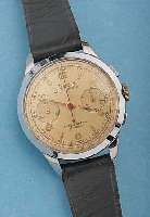 EXATUS ARMBANDCHRONOGRAPH, SCHWEIZ UM 1945, METALL VERCHR., EDELST.-BODEN U. GLASR. GEDR.,ORIG.-BLATT FARBL. GET., 30-MIN.-STOPPZäHLER, TELE- U. ...