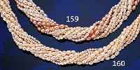 10-REIHIGE PERLENKETTE MIT FEINEM LüSTER, SCHLIEßE GG 585/000, J. KöHLER PFORZHEIM, PERLE IN WEIß UND NATUR APRICOT, PERL-D. CA. 3 UND 5 ...