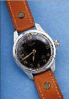 CRONO WATCH ARMBANDUHR MIT EINGEB. TASCHEN- UHRWERK, SOGEN. NOTUMBAU, UM 1946, ALU- MINIUMGEH., BOD. U. GLASR. AUFGEDR., KL. SEK. BEI ZIFFER ...