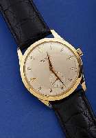 UNIVERSAL GENEVE HERRENARMBANDUHR, REF.-NR. 109508/3, SCHWEIZ UM 1964, GG 750/000, BODEN GEDR., METALLCUV. ZUR ARMIERUNG, GUILL. U. VERS. BLATT, ...