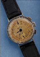 BREITLING ARMBANDCHRONOGRAPH, SCHWEIZ UM 1942, METALL VERCHR., EDELST.-BOD. U. GLASR. AUFGEDR., GEH.-NR. 422194, ORIG. BL. U. ZEIGERFL., GEH. ...