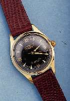 LACO HERRENARMBANDUHR VW 100.000, REF.-NR. 62679, DEUTSCHL. UM 1958, METALL HART VERG., BER., EDELSTAHL SCHRAUBBODEN, LEDERBAND NEU, 21 ST., ...