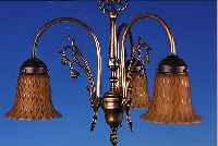 DECKENLAMPE, WOHL DEUTSCH, 30ER JAHRE, , BRONZEMONTUR, DREI SCHIRME SCHICHTGLAS MIT GELBEN, BERNSTEINFARBENEN UND BRAUNEN EIN- PUDERUNGEN, ...