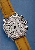 COMOR ARMBANDCHRONOGRAPH GRAND PRIX, REF.- NR. 051/229, SCHWEIZ UM 1996, EDELST., TEILW. POL., BOMB. MINERALGL., BODEN GEDR., AUF BODENLIM. AUFL. ...