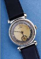 OMEGA HERRENARMBANDUHR ART DECO, REF.-NR. 9102808, SCHWEIZ UM 1938, EDELST., ORIG.- BLATT FL., 15 ST., HANDAUFZUGKAL. 26,5, SCHR.-UNR., ...