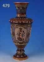 FUSSVASE, METTLACH, 1903, FEINSTEINZEUG, UMLAUFEND REICH GEERITZTER DEKOR, VIER KARTU- SCHEN MIT SPIELENDEN KINDERN, ABSTRAKT FLORAL VERZIERRT, ...