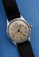 UNIVERSAL GENEVE HERRENARMBANDUHR, SCHWEIZ UM 1950, EDELST., BODEN GESCHR., ORIG.-BLATT ALTERSBED. FARBL. GET., 15 ST., RUNDANKERW., ...