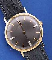 OMEGA ARMBANDUHR, SCHWEIZ/USA UM 1974, GG 585/000, D. CA. 31 MM, BODEN GEDR., 1/4-STD.- ZEICHEN NACHTR. M. IN WG GEF. DIAMANTEN, RUND-ANKERW. ...