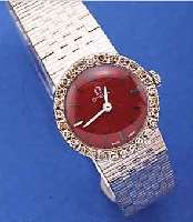 OMEGA DAMENGOLDBANDUHR, SCHWEIZ UM 1968, NEUTR. WG 750/000 INCL. WG-BAND, LÜNETTE M. DIAMANTEN, TEILW. KL. KERBEN/BESCH., BODEN GEDR., ...