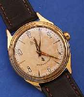 GUB HERRENARMBANDUHR, REF.-NR. 252974, DEUTSCHLAND UM 1958, METALL HARTVERG., BER., EDELST.-BODEN GESCHR., ORIG.-BLATT ALTERSBED. FARBL. GET., ...