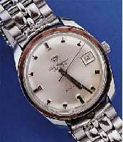 JULES JÜRGENSEN HERRENARMBANDUHR AUTOMATIK, SCHWEIZ UM 1964, EDELST., BODEN GESCHR., NEU- TR. EDELST.-BAND, WERK VERG., ZENTRALROTOR, 17 ST., ...
