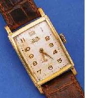 GUB HERRENARMBANDUHR, REF.-NR. 96300, DEUTSCHLAND UM 1953, METALL RECT., BER., EDELST.-BODEN GEDR., BLATT VERS., FL., FORM- ANKERW., ...