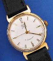 GUB HERRENARMBANDUHR, REF.-NR. 9501, DEUTSCHLAND UM 1961, METALL ROTVERG., BER., EDELST.-BODEN GEDR., ZIFFERBL. LT. EINL. ERN.,17 ST., ...