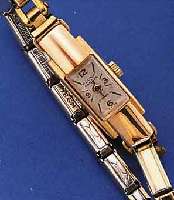 FLUVA DAMENARMBANDUHR, SCHWEIZ UM 1950, RG 750/000, BODEN GEDR., SPANGE WURDE ENTF., DAFÜR METALLZUGGLIEDERB. M. GG-AUFL., VERS. BLATT, ALTERSBED. ...