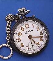 JUNGHANS TASCHENWECKER, DEUTSCHLAND UM 1924,BRüN. STAHLGEH., EMAILBL. (HANDBESCHR.), KAL. 7R, GEH- U. WECKWERK EIN ANTRIEB, NICKEL-KETTCHEN ...
