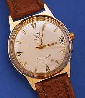 GUB ARMBANDUHR, REF.-NR. 026810, DEUTSCHLANDUM 1965, METALL ROTVERG., BER., EDELST.-BODEN GEDR., ORIG.-BLATT FL., DATUM, 17 ST., HAND- AUFZUGKAL. ...