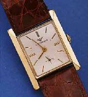 WITNAUER HERRENARMBANDUHR, SCHWEIZ/USA UM 1952, GG-FILLED, CARREE-FORM, BODEN GEDR., KONKAVGL., ORIG.-BLATT ALTERSBED. L. FL., FORMANKERW., ...