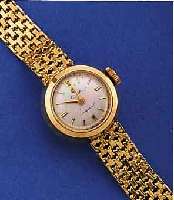CYMA/TAVANNES DAMENGOLDBANDUHR, SCHWEIZ UM 1955, GG 750/000 INCL. GG-BAND, NEUTR. HüLLE, BODEN GEDR., VERS. BLATT M. AUFGEL. GOLD-STD.-ZEICHEN, ...