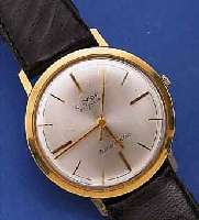 LUXOR HERRENARMBANDUHR AUTOMATIK, SCHWEIZ UM1964, GG 750/000, BODEN U. GLASR. GEDR., VERS. BLATT, 21 ST., 5 ADJUSTMENTS, BASISKAL. ETA 2451, ...