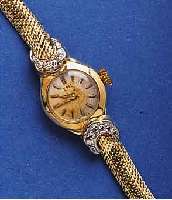DAMENDAMENGOLDBANDUHR BEZEICHNET EBEL, GG 585/000 -GEH. INCL. SCHLANGENGLIEDERB., BANDANST. M. IN WG GEF. DIAMANTEN, BLATT FL., FORMANKERW., 17 ...