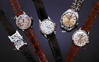 IWC HERRENARMBANDUHR, SCHWEIZ UM 1954, EDELST., BODEN U. GLASR. GEDR., ORIG.-BLATT, LEDERB. SEK., ZENTRALROTOR M. EXCENTERMECHANIK21 ST., ...