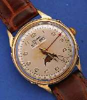 RICHARD HERRENARMBANDUHR VOLLKALENDER INCLUSIVMONDPHASE AUTOMATIK, SCHWEIZ UM 1954, METALLVERG., BER., EDELST.-BODEN GESCHR., ORIG.- BLATT U. ...