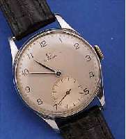 OMEGA HERRENARMBANDUHR, SCHWEIZ UM 1950, EDELST., BODEN U. GLASR. GEDR., VERS. ORIG.- BLATT, ORIG.-ZEIGER, 15 ST., HANDAUFZUGKAL. 30T2, ROT ...