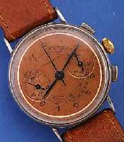 NORD WATCH ARMBANDCHRONOGRAPH, SCHWEIZ UM 1940, METALL VERS., EDELST.-BODEN U. GLASR. GEDR., KUPFERFARB. BLATT, 30-MIN.-STOPPZäHLER,BASISKAL. ...