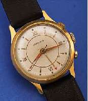JUNGHANS ARMBANDWECKER, DEUTSCHLAND UM 1956, METALL VERG., BER., EDELST.-BODEN GEDR.,VERS. ORIG.-BLATT, WECKBEREITSCH. AUßEN 4, WECKZEIT ...
