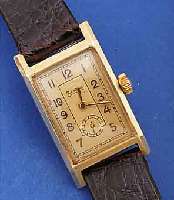 ZENTRA HERRENARMBANDUHR, DEUTSCHLAND UM 1938, GG 585/000-GEH., RECT.-FORM, BODENSCHAR-NIER, LEDERB. NEU, 2-FARB. VERG. BLATT, 8-ECK FORMANKERW., ...