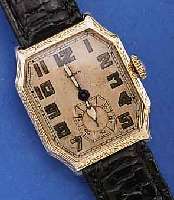 ELGIN HERRENARMBANDUHR, USA UM 1929, GG- FILLED, LüNETTE U. SEITL. SCHMUCKGEPR., ORIG.-BLATT ALTERSBED. FL., KL. SEK. VERT., RUNDAN- KERW., 15 ...